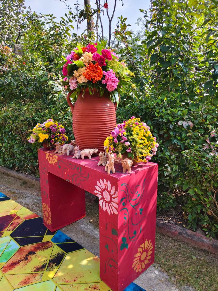 Terracotta urn with colorful outdoor floral arrangements